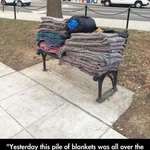 image for A city worker washes and folds these blankets for the homeless.