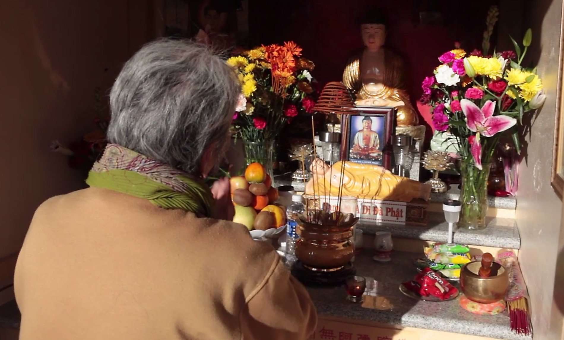 image for TIL about the Oakland Buddha, placed by a resident on a street corner to prevent illegal dumping, the statue has now become a shrine for the local Vietnamese population who leave offerings and have even built a shelter for the Buddah. Crime in the area dropped 82%
