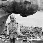 image for Boy standing in front of fallen statue of Lenin, Ethiopia, 1991 [818×1200]