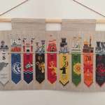 image for [NO SPOILERS] My Christmas present from my Gran this year. A cross-stitch banner of the Great Houses. Took her the whole year!