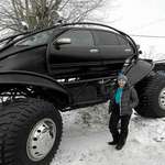 image for A Nissan Maxima monster truck snowmobile.