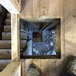 image for View into a basement after chimney removal.