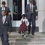 image for Ruby Bridges escorted by U.S. Marshals to attend an all-white school, 1960. She was the first African-American child to desegregate the all-white William Frantz Elementary School in Louisiana during the New Orleans school desegregation crisis.