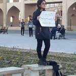 image for Iranian girl takes off her compulsory hijab and protests against mandatory dress code for women