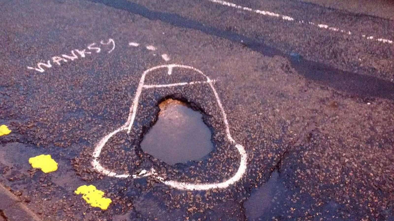 image for Manchester man draws penises around potholes so the city will fix them