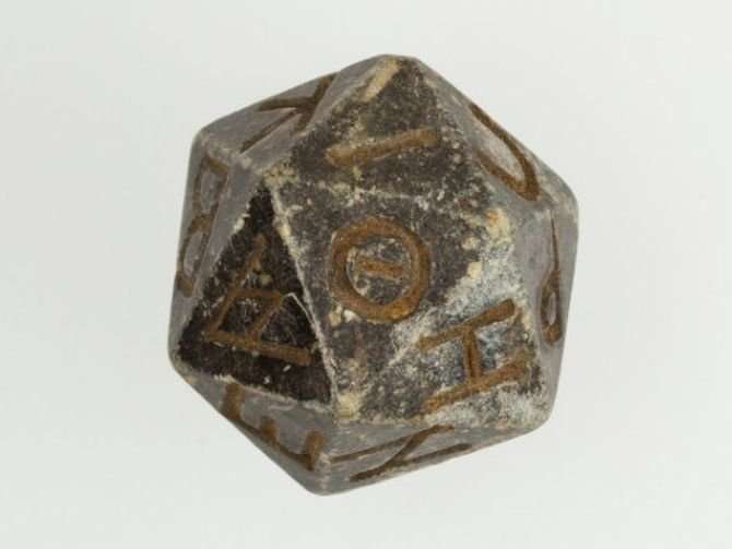 image for Ancient d20 die emerges from the ashes of time