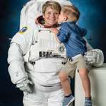 image for NASA astronaut Anne McClain brought her 4-year-old son to a spacesuit photo shoot.