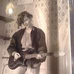 image for My mom sometime in the 80s messing with my dads guitar (Birmingham UK)