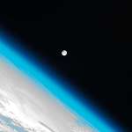 image for Photo of the Earths atmosphere and the moon. Shot by the international space station.