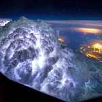 image for Looking down on a thunderstorm from above the clouds.
