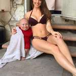 image for At 2 ft 8 in (0.81 m), actor Verne Troyer was one of the smallest men in the world. 5 ft 5 in (1.7 m) girl for scale.