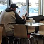 image for This guy painting birds at a McDonald's.