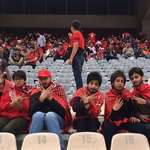 image for Women are not allowed to attend soccer matches in Iran. 5 girls sneak in Azadi Stadium in disguise to celebrate Persepolis championship in Iran's Persian Gulf Pro League.