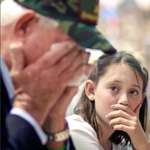 image for The photo is of a young granddaughter watching her grandfather break into tears at her school's Veterans Day Assembly. This photo will be displayed in Caelum Gall this October!