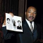 image for The 'Mississippi Burning' Murders - Martin Luther King holds up photos of the three young civil rights workers murdered in Mississippi the previous summer. - Dec. 4, 1964 in New York City.