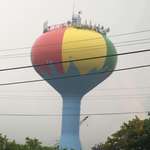 image for The water tower in Ocean City, Maryland is painted like a giant beach ball on a spout of water.