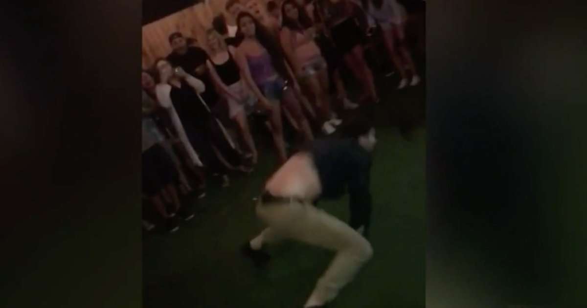 image for Dancing FBI agent charged with second-degree assault, booked into jail over back flip gunfire