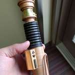 image for I made a lightsaber out of wood, brass, and leather. What do you all think?
