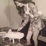image for Woman cutting her birthday cake in Tehran, Iran 1973