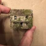 image for When I am feeling stressed, I make tiny things. Here is a tiny abandoned cabin I made.