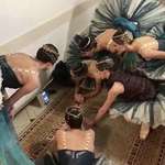 image for Dancers of the Bolshoi ballet backstage during a performance watching their national team win a penalty shootout during the World Cup.