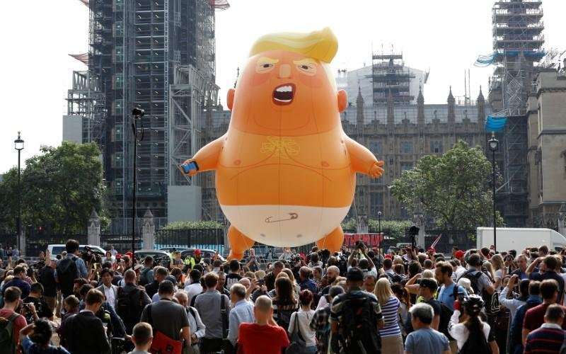 image for Snarling orange 'Trump baby' blimp flies outside British parliament