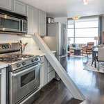image for $1 million San Francisco loft has diagonal support beam that cuts through the middle of the kitchen