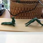 image for A lady in my office has a basket of green army men in yoga poses