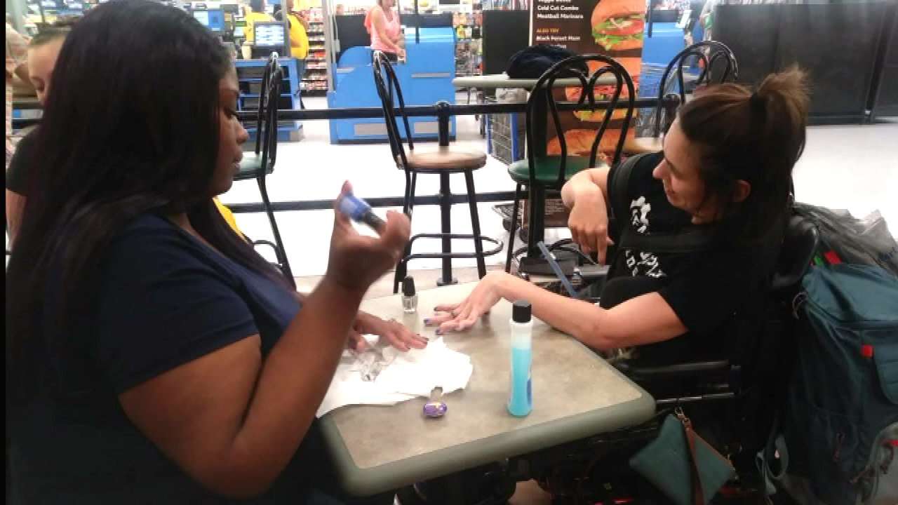 image for Walmart cashier steps in when nail salon refuses wheelchair-bound woman