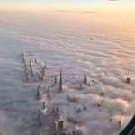 image for Towers of Dubai breaking through the clouds
