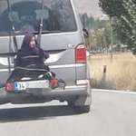 image for This man strapped his own daughter to the back of a car