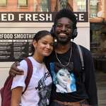image for Girl wearing Andre 3000 shirt runs into him walking out of a coffee shop and takes a picture with him