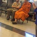image for My father having small talk with a monk while waiting at the DMV.