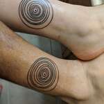 image for The wife and I got tattoos of a diagram depicting the position of the planets as they were the exact time we were married. Izic Woodall, Holy Grail Tattoo, Lakeland, Florida.