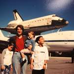 image for The family posing in front of shuttle Discovery before my dads launch