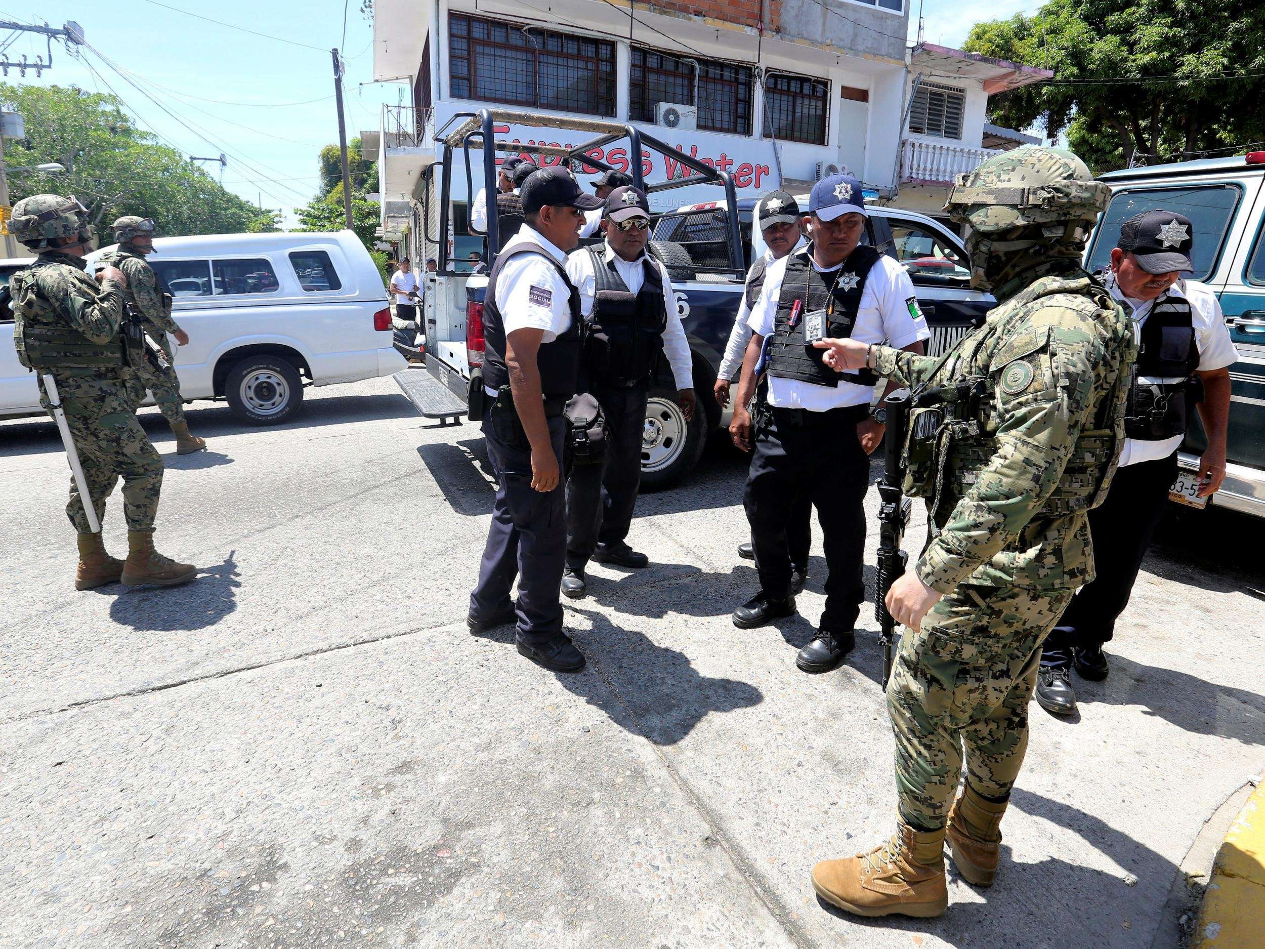 image for Mexican military disarm entire police force in resort city of Acapulco 'corrupted by drug gangs'