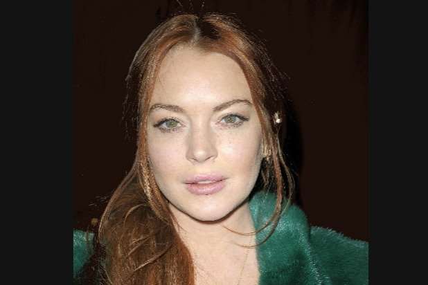 image for Lindsay Lohan Gets Punched in Face After Accusing Refugee Family of ‘Trafficking’ (Video)