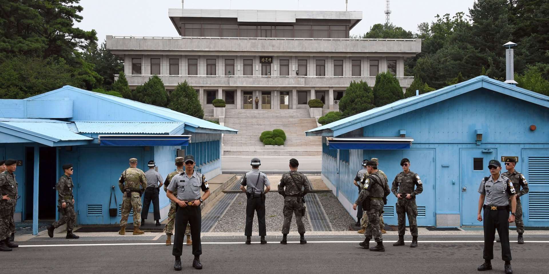 image for North and South Korea begin disarming their heavily fortified border