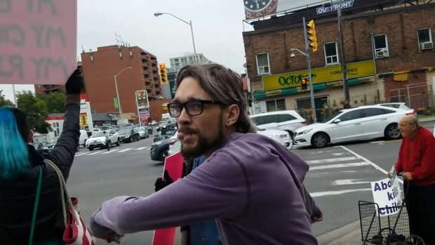 image for Man claiming to defend women's rights, caught on cam kicking female anti-abortionist