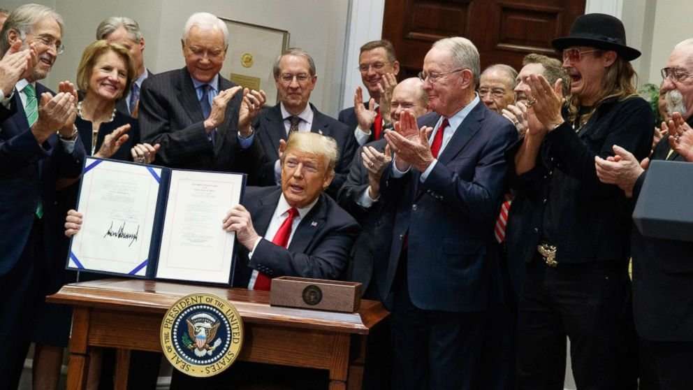 image for Trump signs bill that ensures music streaming services pay artist royalties