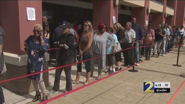 image for Crowds swarm polls in record numbers for early voting in Georgia