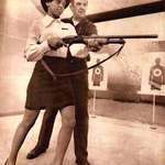 image for Saundra Brown, the first black woman on the Oakland police force gets instructions on how to shoot a shotgun, 1970. She is now the Senior Judge of the United States District Court for the Northern District of California.