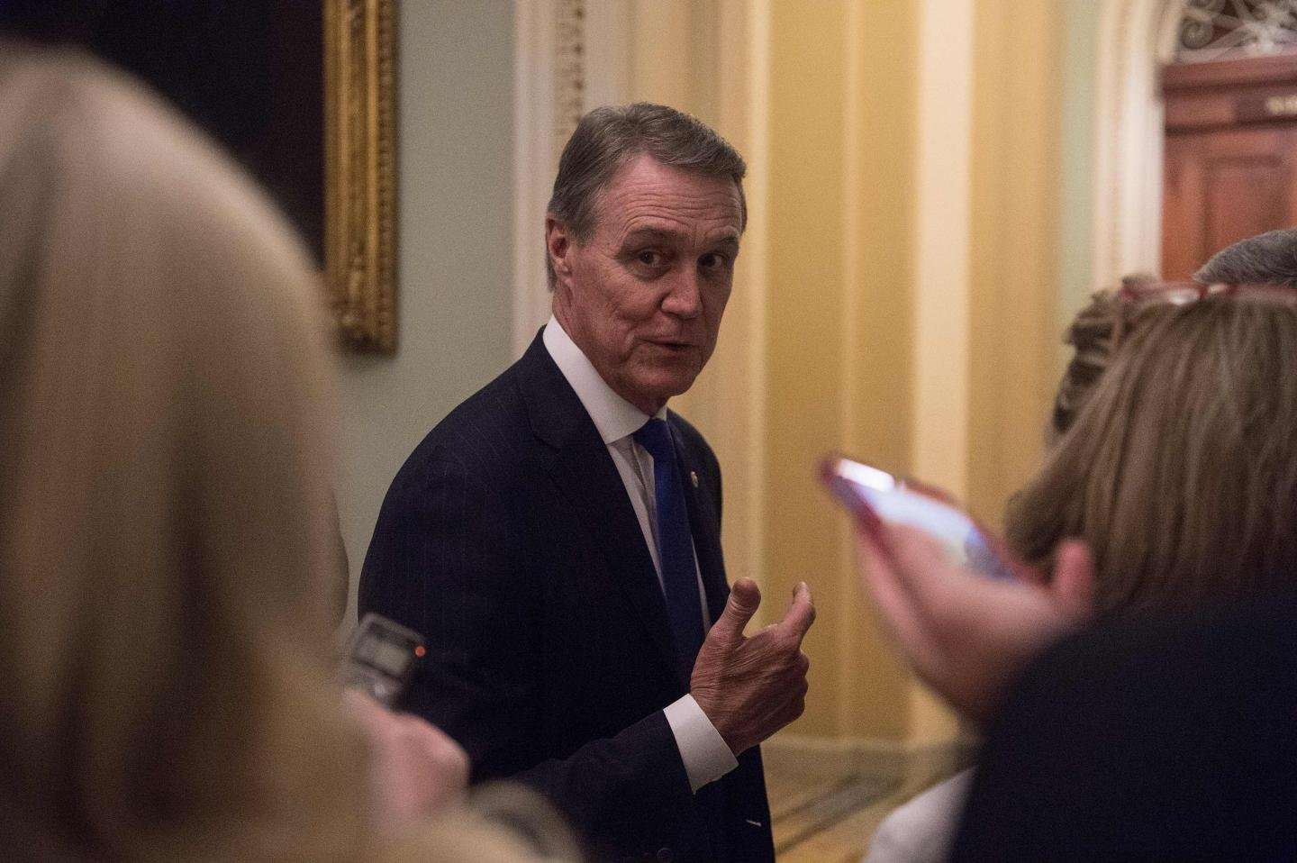 image for GOP Senator David Perdue Faces Battery Lawsuit After Snatching Student's Phone