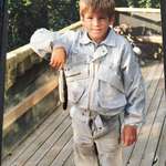 image for In honor of his 42nd birthday, here's Ryan Reynolds back in 1983 holding a dead fish... with his fly open