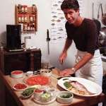 image for Anthony Bourdain preparing a meal in his New York City apartment, 1986