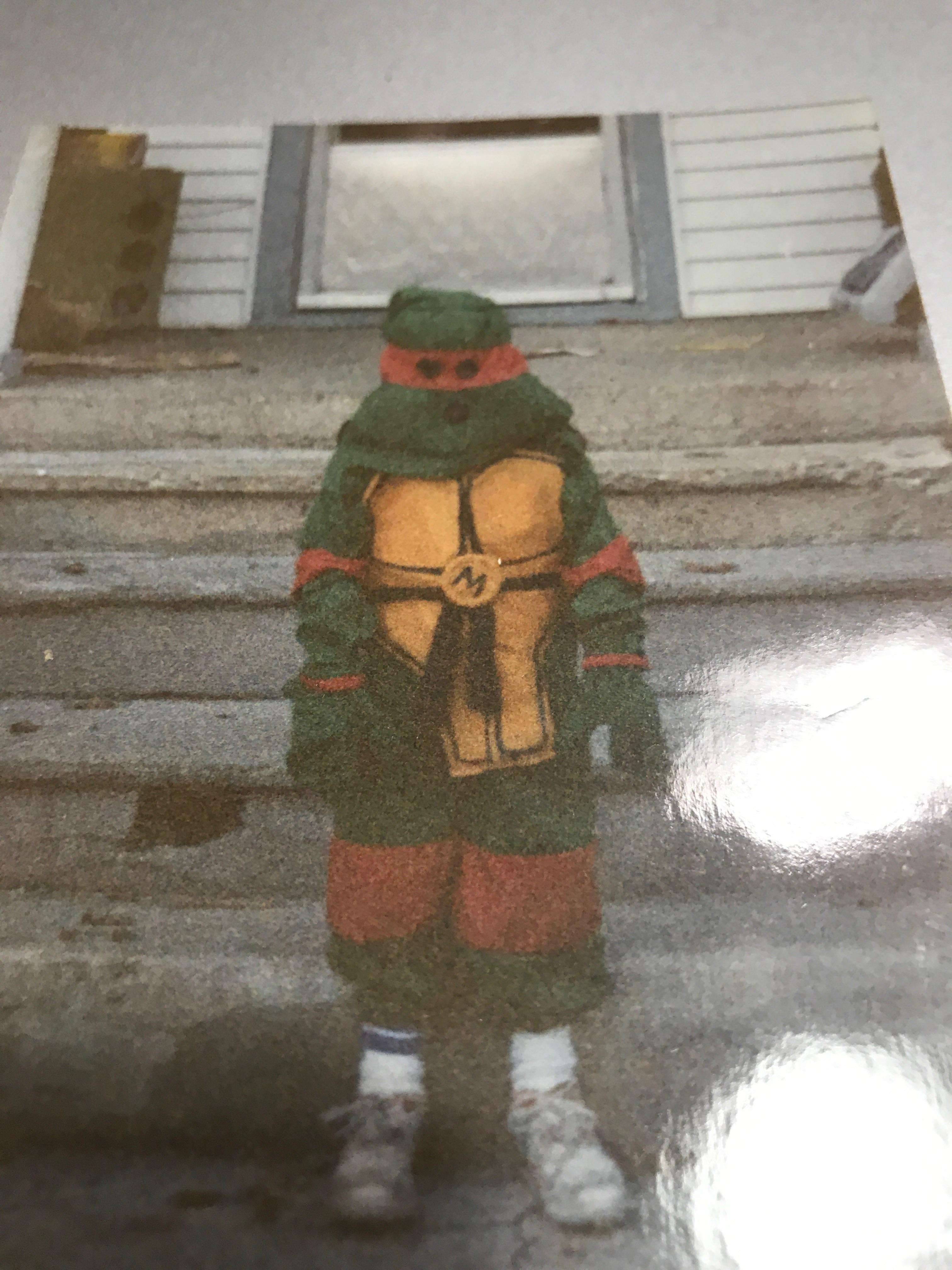 image showing My dad was going through old photos recently, He found this picture of me on Halloween dressed as Michelangelo, my mom made this costume from scratch