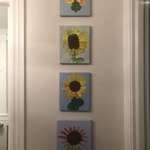 image for 4 paintings of the same sunflower by each of my 4 children, all painted at the same age of 5