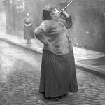 image for A 'Knocker-up' was hired to ensure that people would wake up on time for their jobs. Mary Smith earned sixpence a week shooting dried peas at sleeping workers' windows in East London in the 1930s