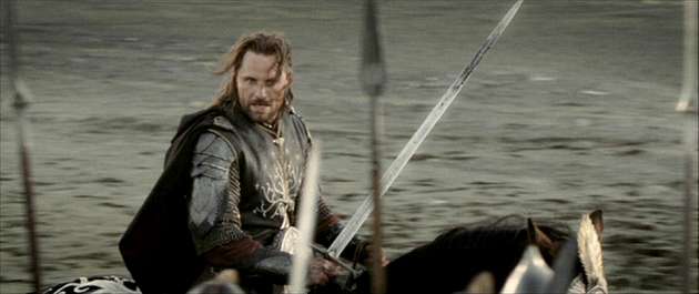 image showing In Lord of the Rings: Return of the King, when Aragorn is giving his speech in front of the black gates, his sword is suddenly tarnished before the battle commences. It's only revealed in the extended edition, that it is due to beheading the Mouth of Sauron, a scene that did not make the final cut.
