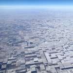 image for This is flat farmland in Eastern Colorado with wind blown/melted patches of snow creating a crazy 3D illusion.